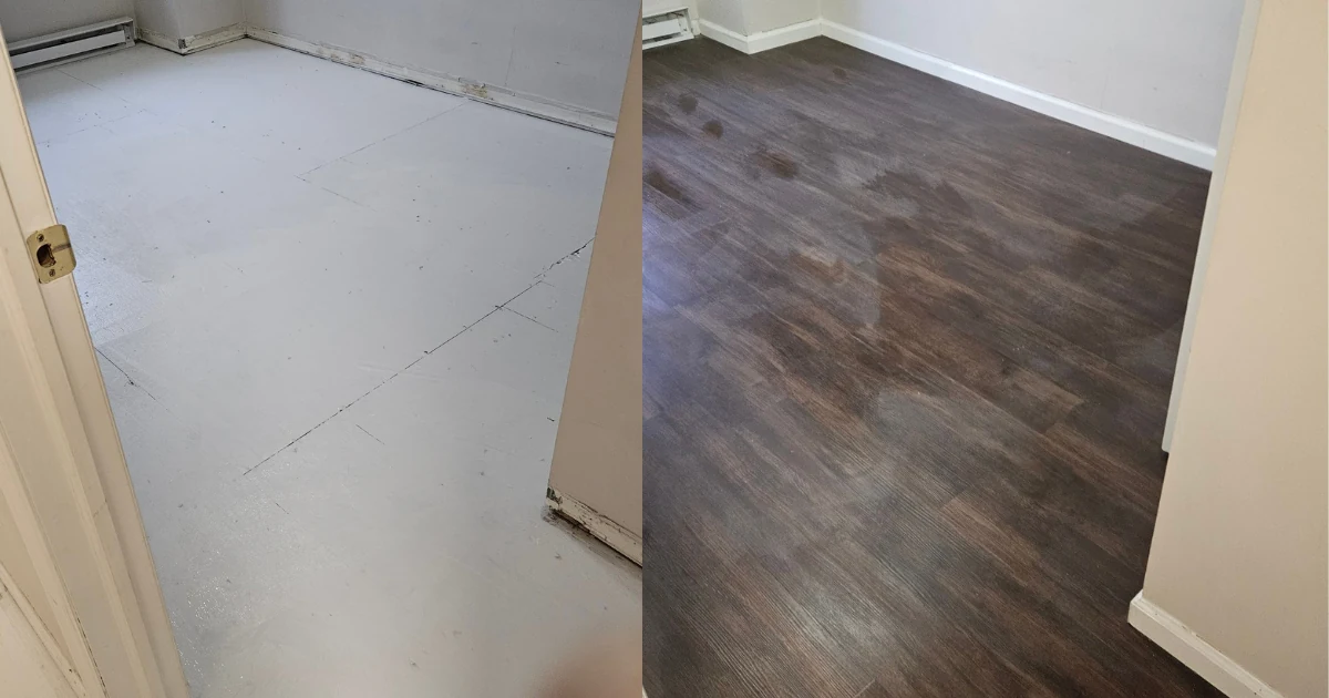Room with exposed subfloor and unfinished baseboard area on the left, installed dark flooring and white baseboards on the right